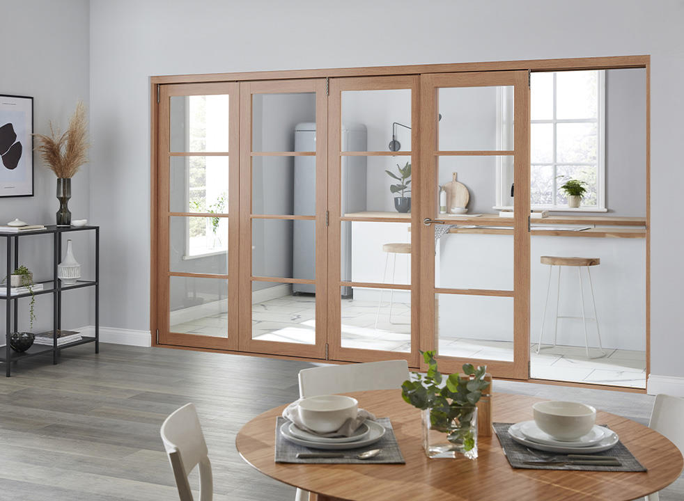Access door open - Finesse Oak 2.1m (approx 7ft) Internal Bifold Doors - with bottom track