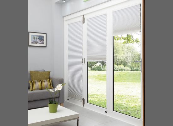 Master White 4.2M Bifold doors White trim Blinds partially open