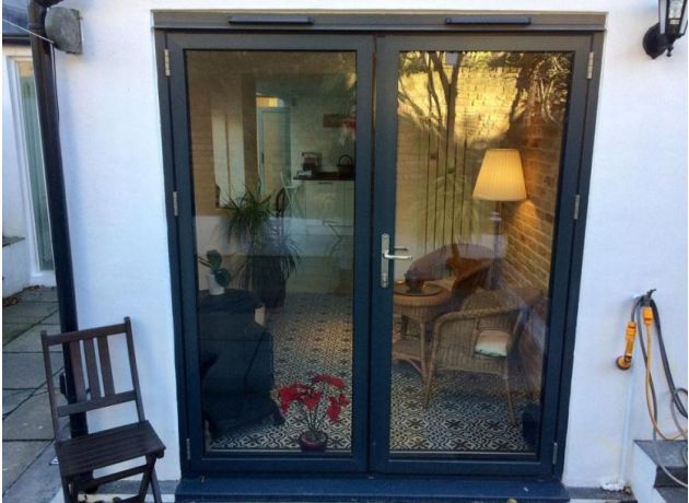 Status 1.8M French Aluminium doors add light into a side extension
