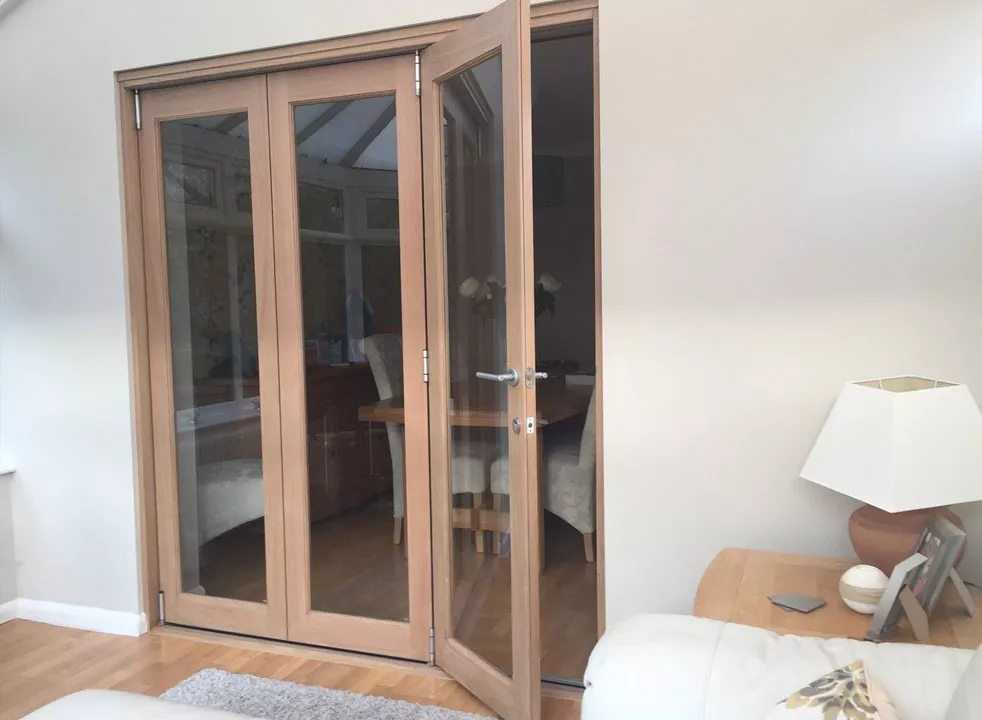 Oak internal bifold doors in Sutton Coldfield conservatory installation