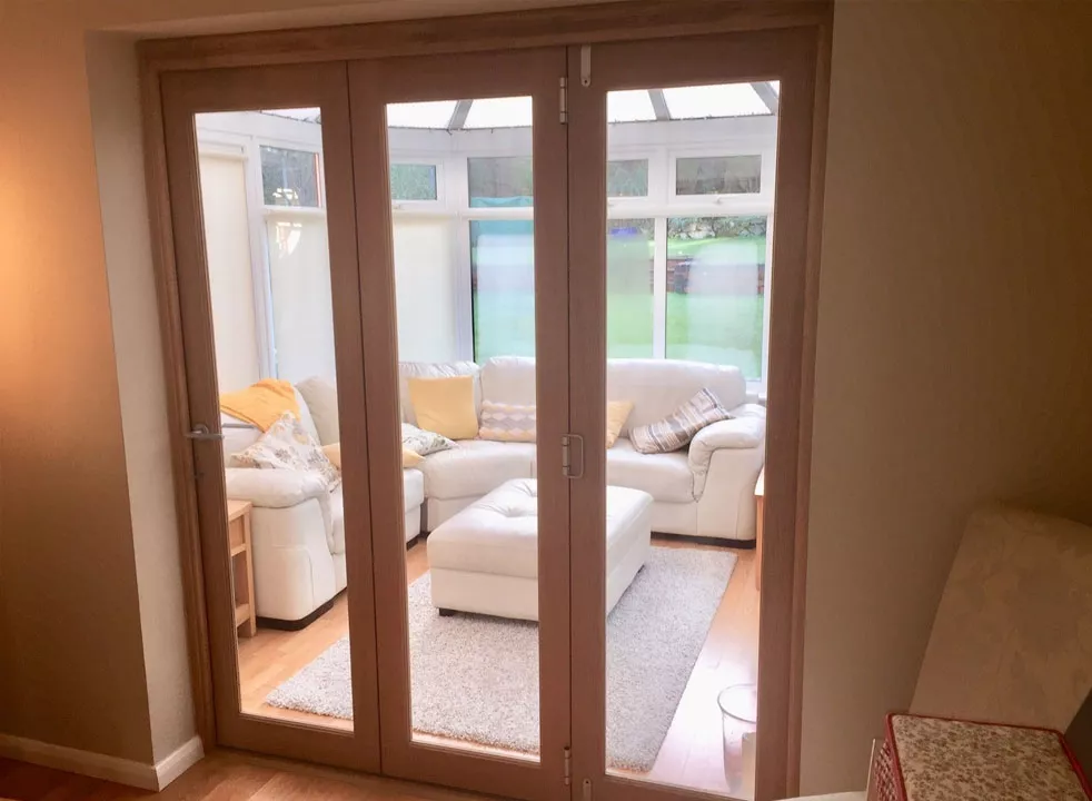 Oak internal bifold doors in Sutton Coldfield conservatory installation