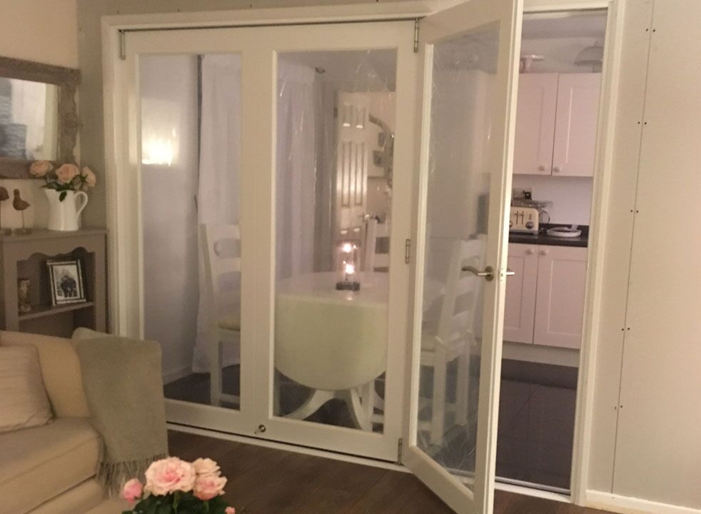 Access door open on a Finesse white internal bifold door