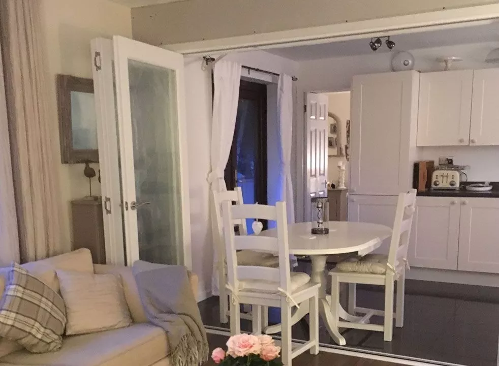 White timber internal bifold doors - open