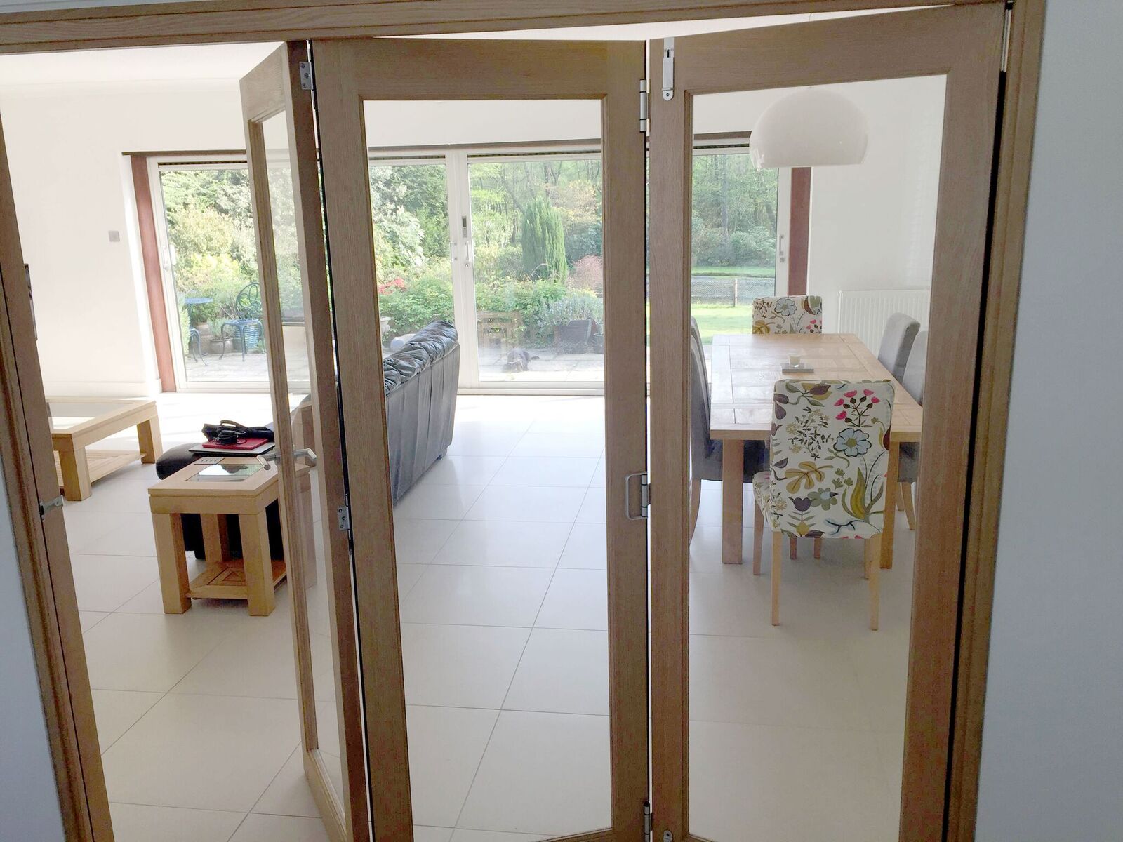 Finesse 2.1M Internal Bifold Doors connects the kitchen with lounge