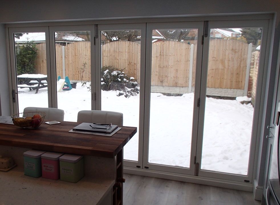 Master White 3.6M Bifold door closed looking on to the garden