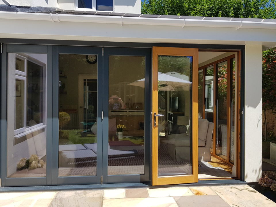 Outside view with access door open - Ultra Grey 3.6M Bifold doors