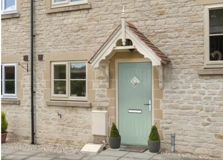 Image of a green front door of a old style terraced house