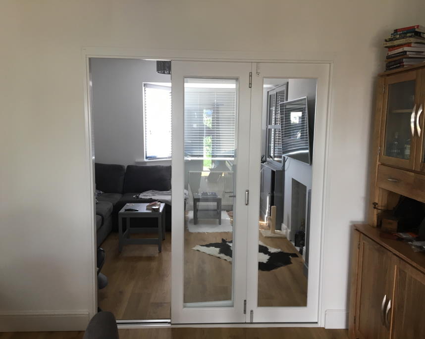 Access door open on a Finesse 1.8M White Internal Bifold doors