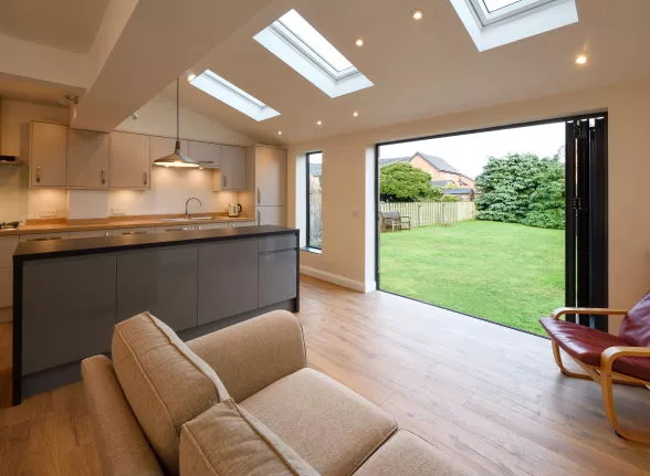 Inside view of open Anthracite aluminium bifold doors on a 1930s house extension