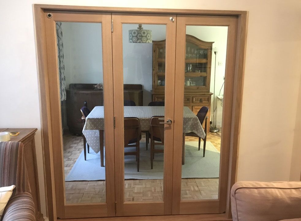 Inspire internal 1.8M bifold doors divides the lounge and dining room