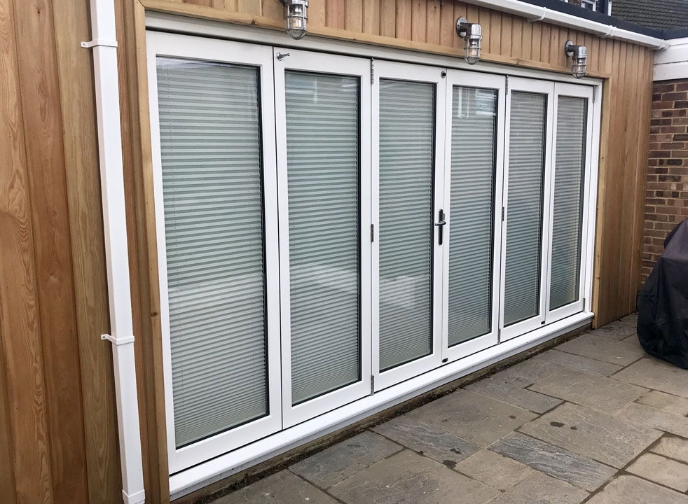 Master White 4.2M Closed timber bifold doors with blinds closed