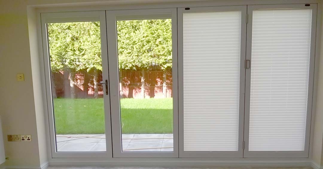 Inside view with half the blinds shut - Supreme 3.6M White Aluminium bifold doors