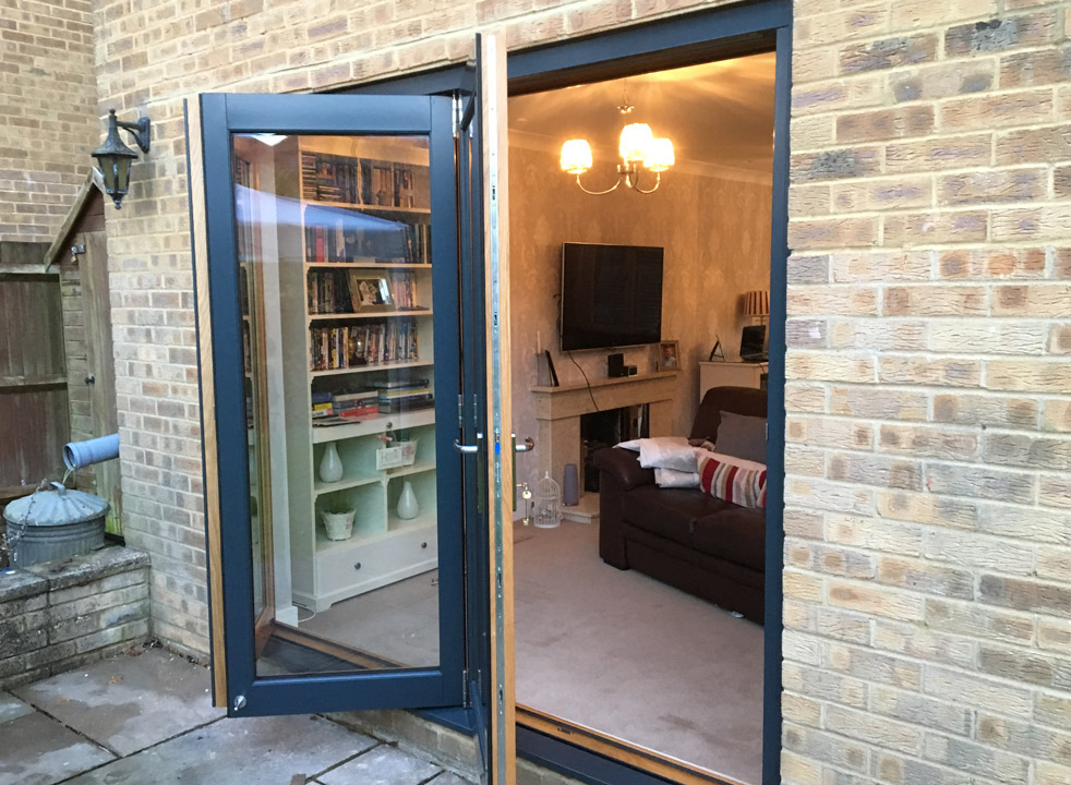 Access doors open on a 2.4M Grey External Bifold Door set