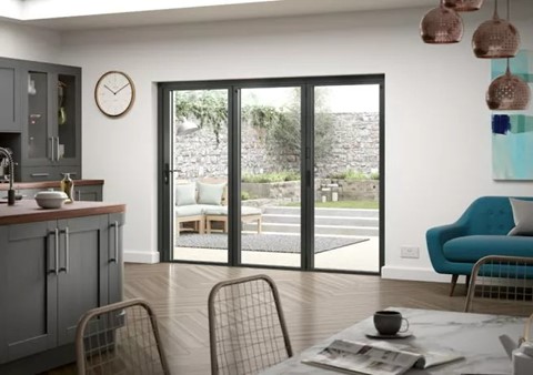 Closed bifold doors leading on from the kitchen and overviewing the garden